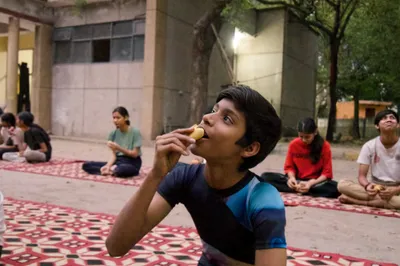 Children practicing yoga at AumYogaShala Foundation